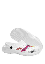 Bottom view of white slippers showing tread and bold graphic toe detail