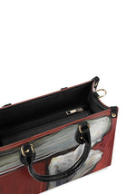 View inside horror-themed handbag with zippered inner compartment