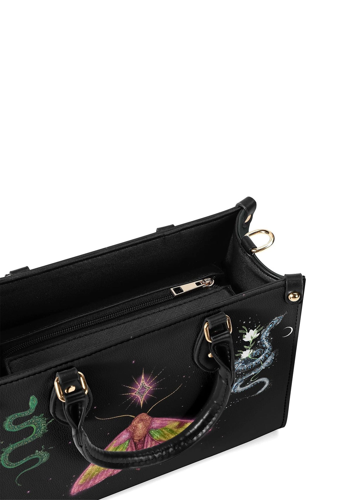Top-down view of handbag’s spacious interior with zippered compartments and detailed cosmic artwork on outer surface