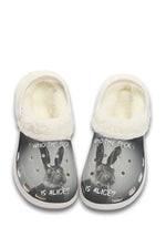 Front view of white lined slippers with yellow-eyed rabbit graphic