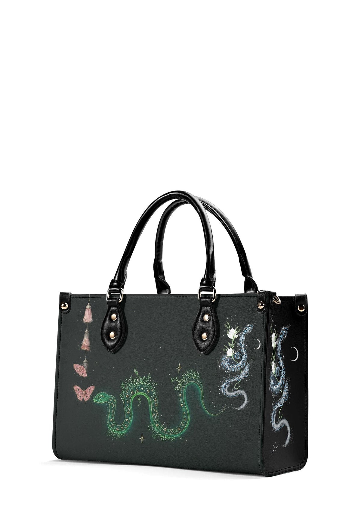Angled view of gothic tote bag showing snake, flowers, and pink tassels design