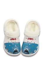 Front view of white fuzzy JAWS slippers with great white shark graphic