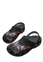 Right angled view of gothic slippers with raised heel strap and bold moth tattoo graphic