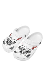 Angled front view of white Whispers In Bloom Slippers with gothic skull moth and flame art
