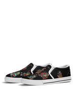 White-trimmed slip-on shoes with vintage cartoon frogs and rainbow anti-tattoo statement on top