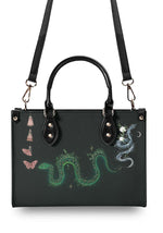 Back view of Serpent Bloom Ritual Handbag with adjustable strap and celestial artwork