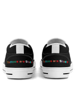 Rear view of white-trimmed slip-ons with colorful “Tattoos are Stupid” slogan on both heels