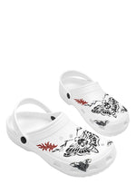 Angled view of white Whispers In Bloom Slippers with strap back and bold tattoo details
