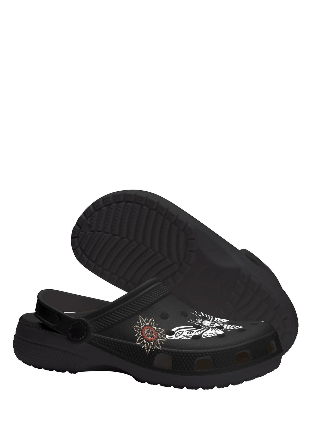 Sole view showing grip texture and floral tattoo detail on black gothic slip-ons