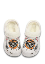Front view of white fuzzy clog with gothic orange moth and floral graphics