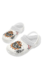 Side angle of white skull moth slipper with red and black rose detailing