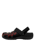 Outer side of black slippers with scary clown face and sherpa trim