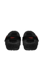 Rear view of cozy slippers with venom moth print and flame detail