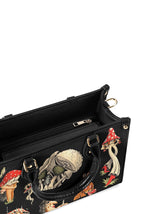 Inside zipper compartment and fabric lining of mushroom handbag