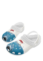 Angled view of white shark slippers with fuzzy lining and movie artwork