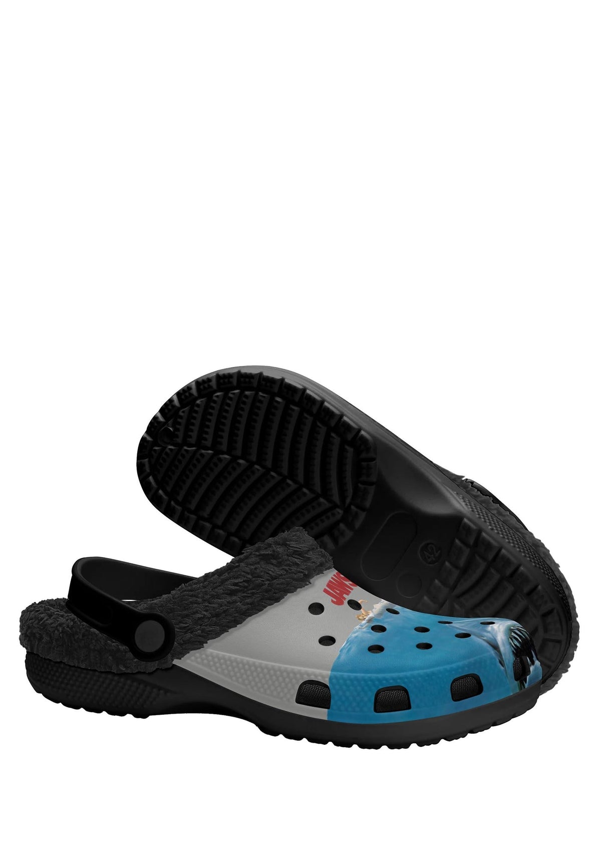 Bottom view of black slipper showing tread and shark-themed toe cap