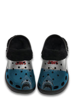 Front view of black fuzzy shark slippers with JAWS logo and great white illustration