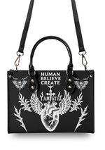 Back view of structured handbag with bold white tattoo-style illustration