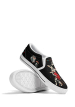 White sole stacked slip-ons with frog, mushroom, and couple tattoo graphics