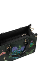 Interior top view showing spacious black lining and zipper pocket inside the gothic celestial handbag