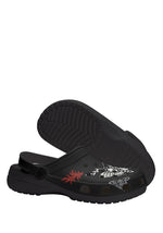 Bottom sole view of Whispers In Bloom Slippers in black with textured grip outsole
