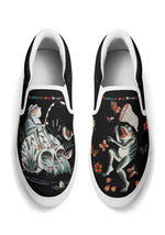 Top view of white-trimmed slip-on shoes with frog fishing and butterfly-chasing illustrations