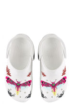 Top view of white clogs with neon moth and skull wing artwork