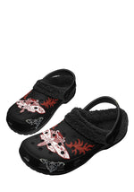 Flat lay of Cursed Moth slippers with fleece and flame print