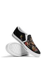 Retro frog art slip-ons stacked, featuring white soles and bright ironic slogan embroidery