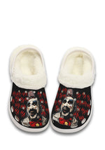 Front view of white fuzzy slippers with creepy clown face and HA graffiti