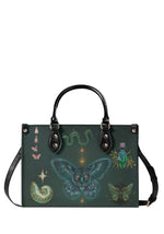 gothic forest green handbag with central panther-moth, green snake and beetle illustrations