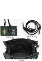 Close-up of adjustable strap, metal buckle, and PU leather interior of the gothic snake print handbag
