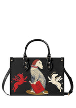 Gothic handbag with tattooed dog reading "How To Be Good" book