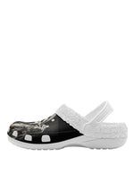 Side view of white slippers with ghost figure and spooky trees