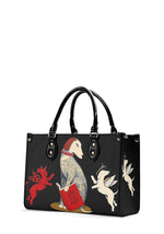 Side view of gothic bag with devil and angel dog illustrations