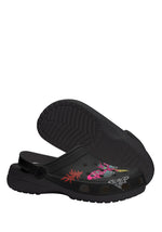 Bottom view of black moth slippers showing sole grip and design