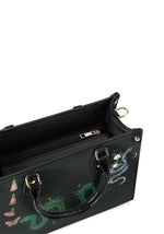 Top view showing inside zipper compartment of gothic floral snake handbag